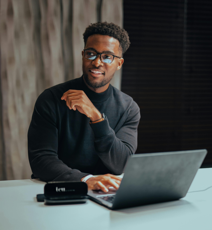 Professional working on laptop in modern office environment